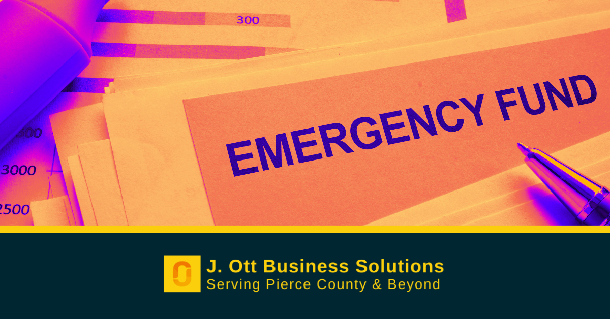 A stack of papers on a desk that read: emergency fund.